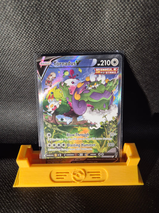 Trading card with colorful artwork on a black textured surface